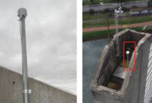 Foto mostrando uma torre de monitoramento climática, com um dispositivo de medição, em área próxima à ferrovia. Palavras-chave: 